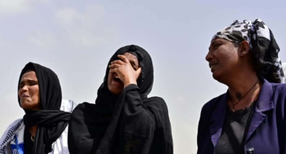 Grief: Relatives arrive at the site.  By TONY KARUMBA AFP