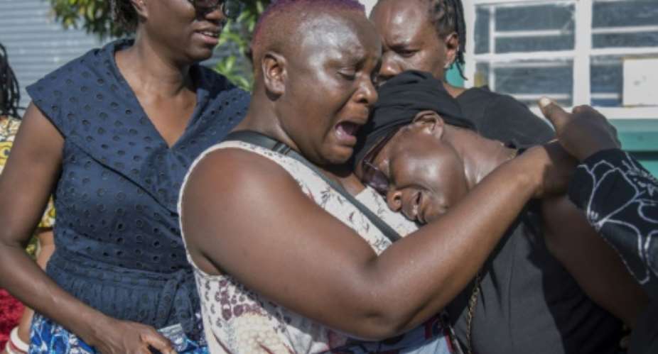 Grieving relatives gathered at Lusaka airport for the arrival of Lemekhani Nathan Nyirenda's body.  By SALIM DAWOOD AFP
