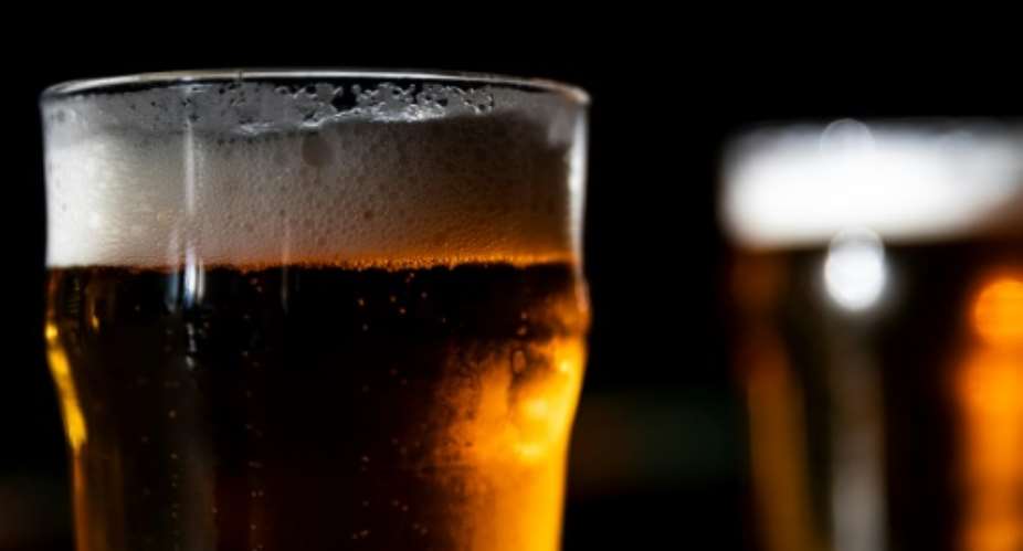 Grin and beer it: Clandestine bars are doing good business in lockdown Libreville.  By KENZO TRIBOUILLARD AFPFile