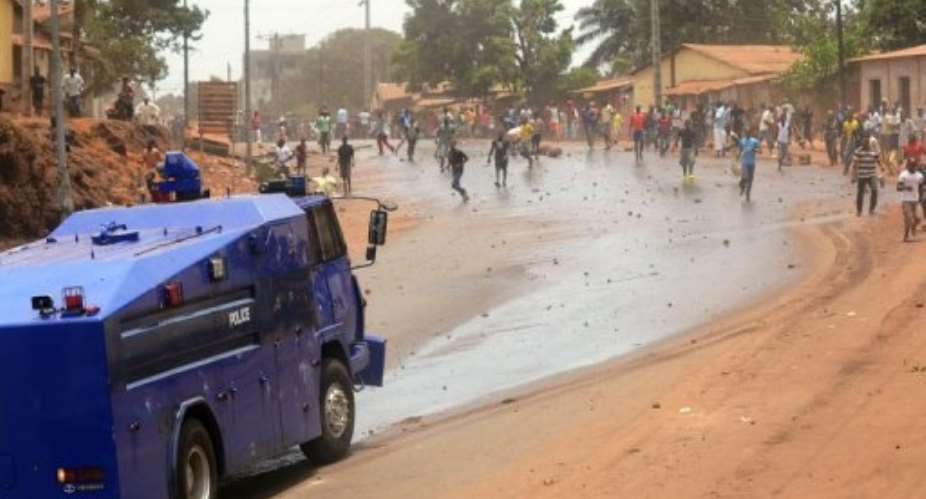 Guineas police use water to disperse protesters on May 2, 2013, in Conakry.  By Cellou Binani (AFP/File)