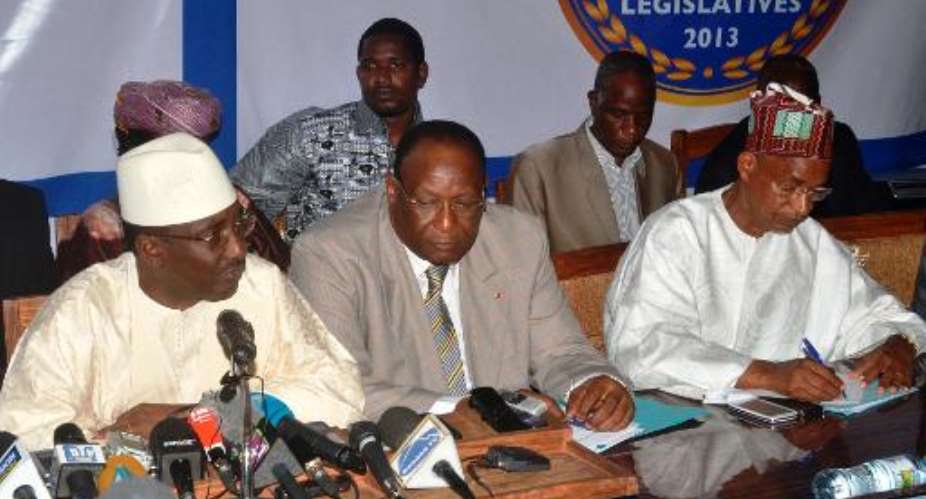 Opposition leaders L-R UFR's Sydia Toure, PEDN's Lansana Kouyate and UFDG's Cellou Dalien Diallo give a press conference on October 4, 2013 in Conakry, Guinea.  By Cellou Binani AFPFile