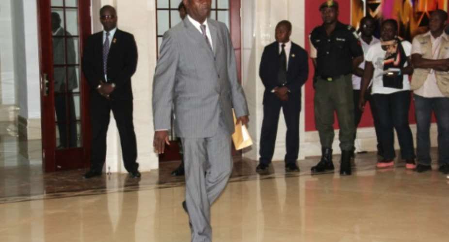 Guinea Bissau's newly appointed Prime Minister Carlos Correia, 81, arrives at the presidential office in Bissau on September 17, 2015.  By Alfa Ba AFPFile