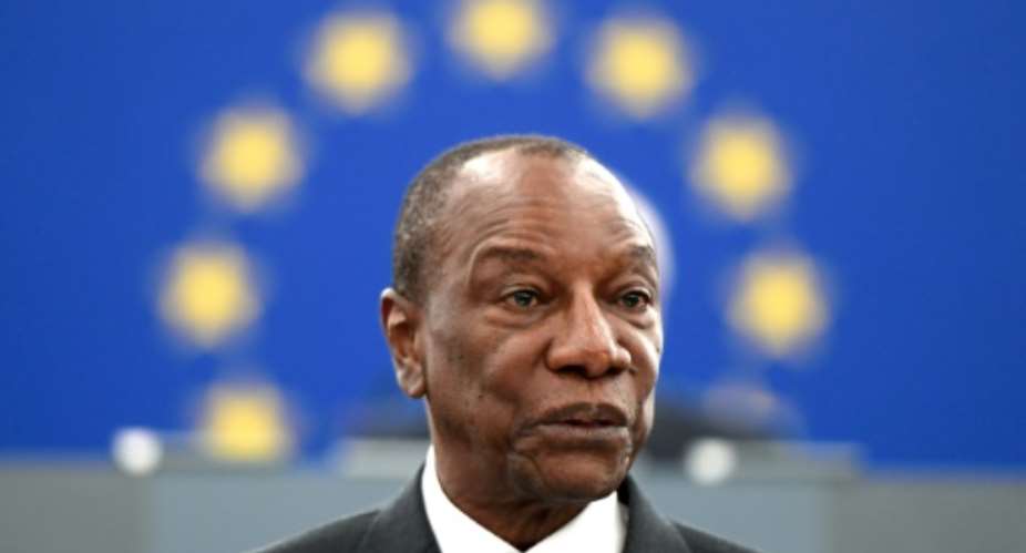 Guinean President Alpha Conde, seen here in May 2018, is facing calls not to amend the constitution to allow himself a new term.  By FREDERICK FLORIN AFPFile