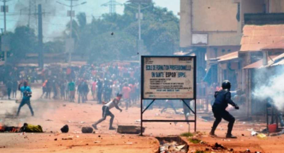 Guinean protesters and police clash during a demonstration in Conakry in March 2018.  By CELLOU BINANI (AFP/File)