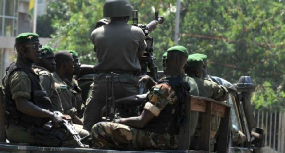 Guinean soldiers, similar to these pictured in 2010, opened fire ona  group of men leaving a house in Conakry, killing two of them.  By ISSOUF SANOGO AFPFile
