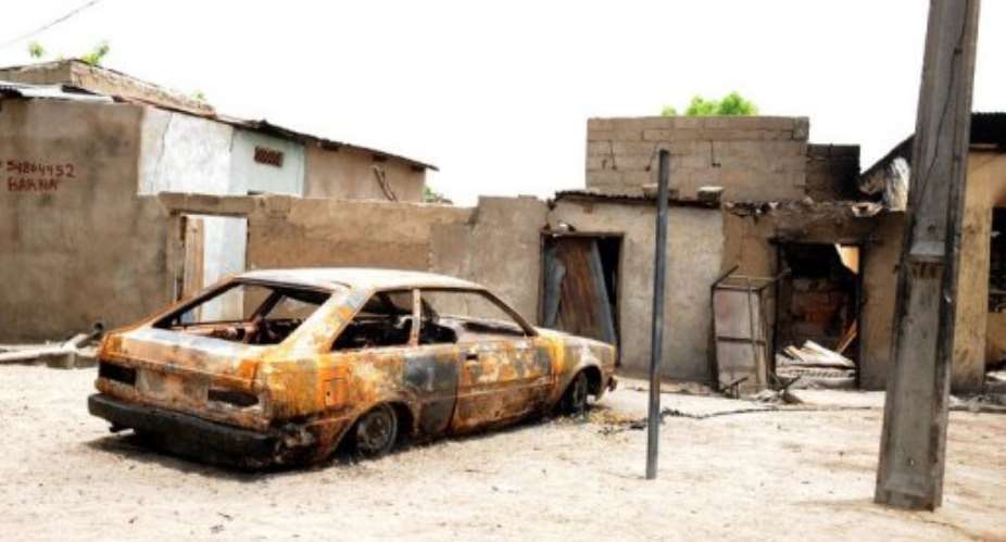 A house and car are ravaged by a bomb explosion by the Islamist group Boko Haram in Maiduguri, Nigeria, in May 2012.  By Pius Utomi Ekpei AFPFile