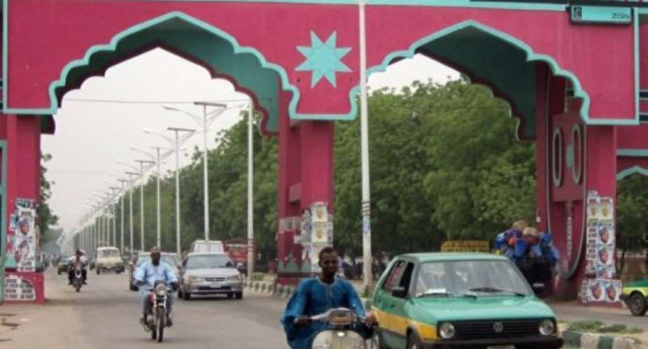Motorists pass through a gate that leads to northern Nigerian city of Maiduguri in 2011.  By Aminu Abubakar AFPFile