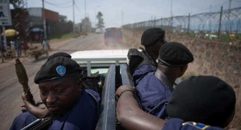 Congolese government policemen drive through the street in Goma in the east of the Democratic Republic of the Congo on December 4, 2012.  By Phil Moore AFPFile