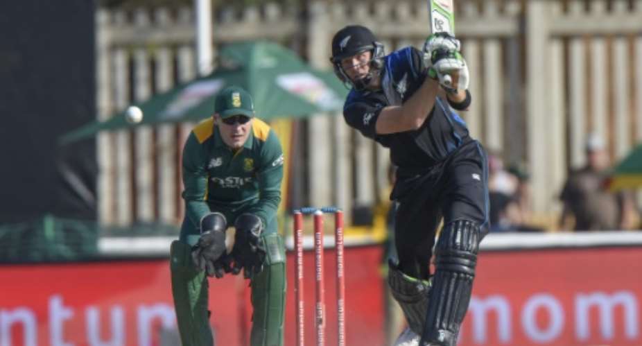Martin Guptill R of New Zealand plays a shot during the second One Day International cricket match between South Africa and New Zealand at Senwes Park cricket ground in Potchefstroom on August 23, 2015.  By Christiaan Kotze AFP