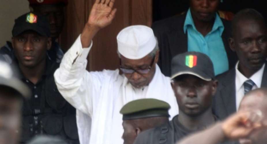 Habre, pictured in 2013 while leaving a court in Dakar. Tens of thousands of Chadians died under his rule, say investigators.  By - AFPFile
