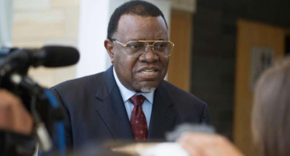 Hage Geingob pictured September 2019 was declared president of Namibia's vote, retaining his position and the ruling South West Africa People's Organisation's long dominance of power.  By RODGER BOSCH AFPFile