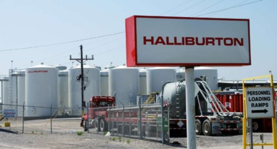 Halliburton will pay nearly 30 million in fines and other fees to resolve a bribery case involving Angola's state oil company.  By MIRA OBERMAN AFP