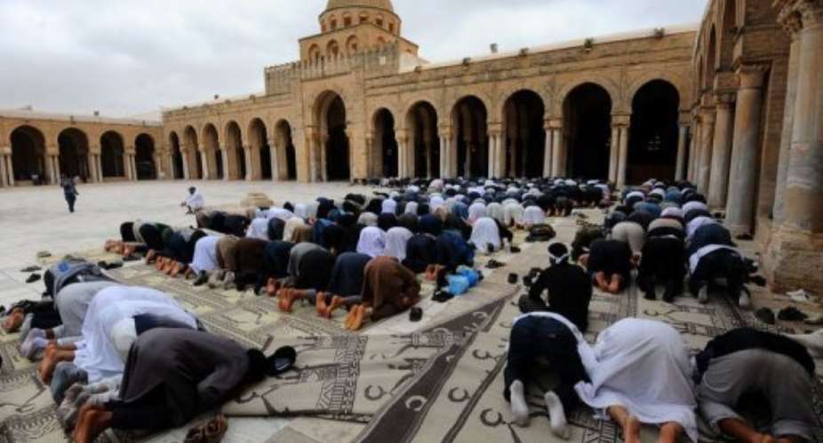Tunisian Islamists pray in Okba mosque in Kairouan.  By Fethi Belaid (AFP)