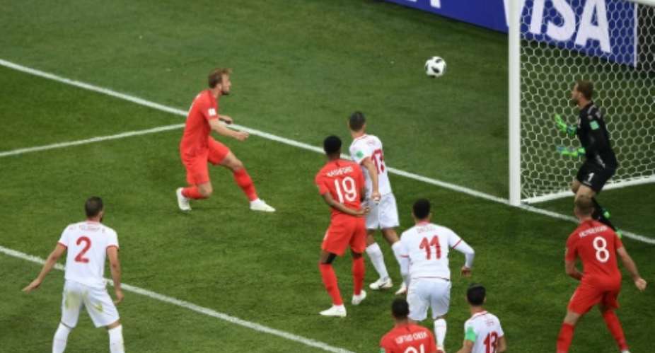 Harry Kane 2L got England out of jail with an injury-time winner to ensure his side claimed all three points from their opening Group G game against Tunisia.  By NICOLAS ASFOURI AFP