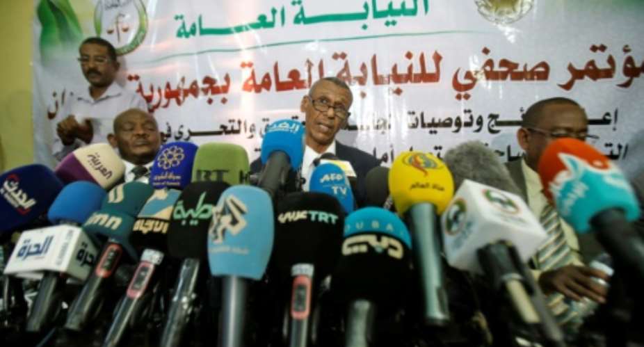 Head of a Sudanese investigative committee Fatah al-Rahman Saeed C reveals findings of a probe into the deadly raid on a Khartoum protest camp.  By ASHRAF SHAZLY AFP