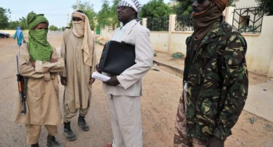 Niger's Bilal Hicham C stands with fighters from MUJAO in July 2012.  By Issouf Sanogo AFPFile