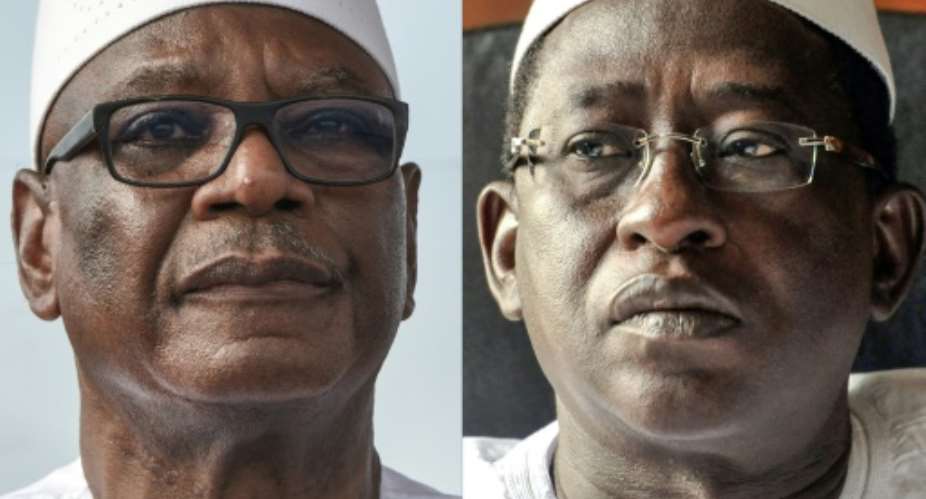 Head to head: Ibrahim Boubacar Keita, left, faces off against opposition leader Soumaila Cisse on Sunday.  By Sia KAMBOU, Issouf SANOGO AFPFile