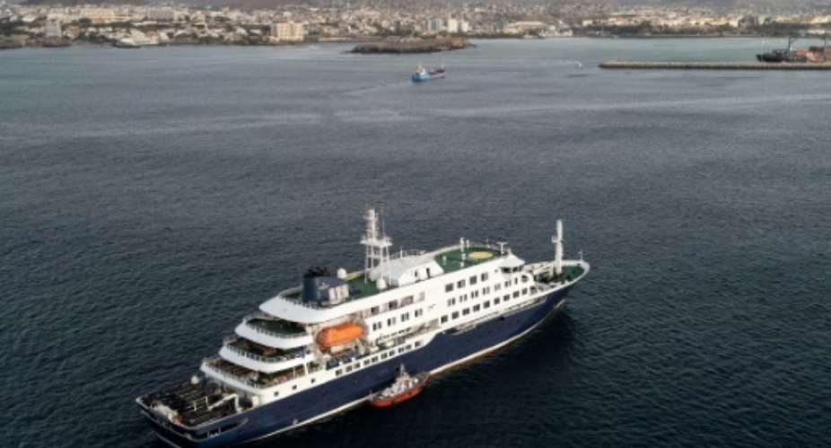 Health personnel board the cruise ship MV Hondius to evacuate infected patients.  By - (AFP)