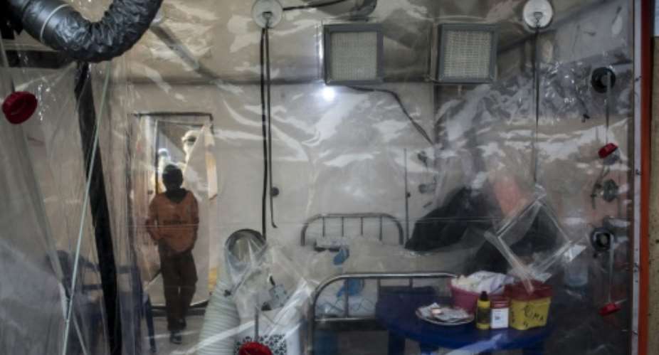 Health workers have set up an emergency care unit in Beni -- Ebola is highly contagious and patients have to be isolated by plastic screens.  By John WESSELS AFP