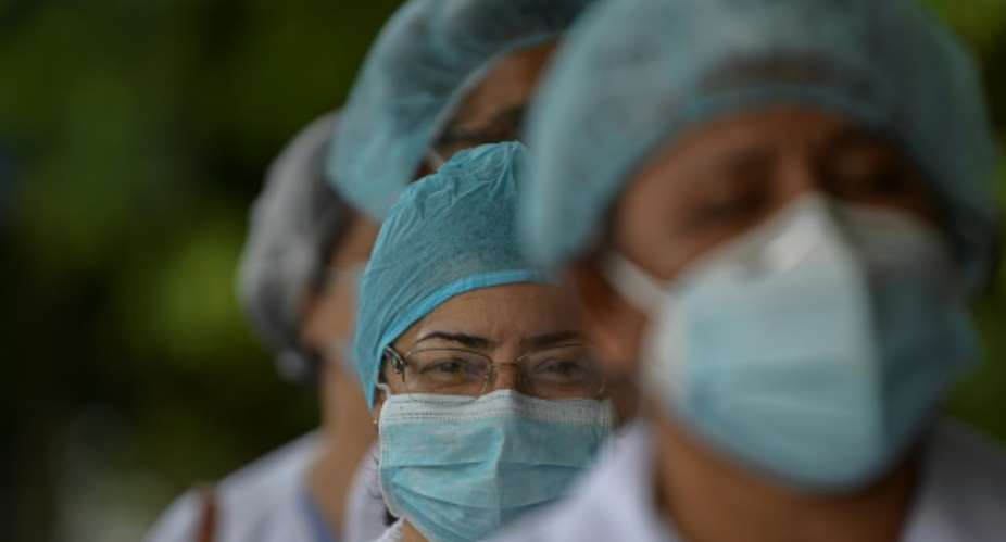 Health workers protest for lack of medical supplies at the Dr Arnulfo Arias Madrid hospital complex in Panama City, on July 16, 2020, as Panama exceeds 50,000 cases of COVID-19.  By Luis ACOSTA AFP