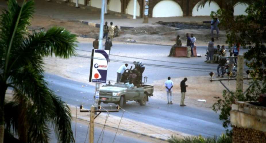 Heavy gunfire broke out in the Sudanese capital as several agents of the long-feared security agency launched a short-lived mutiny.  By ASHRAF SHAZLY AFPFile