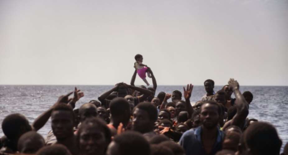 Hellish conditions in Libya drive a surge in the numbers of migrants trying to reach Europe.  By ARIS MESSINIS AFPFile