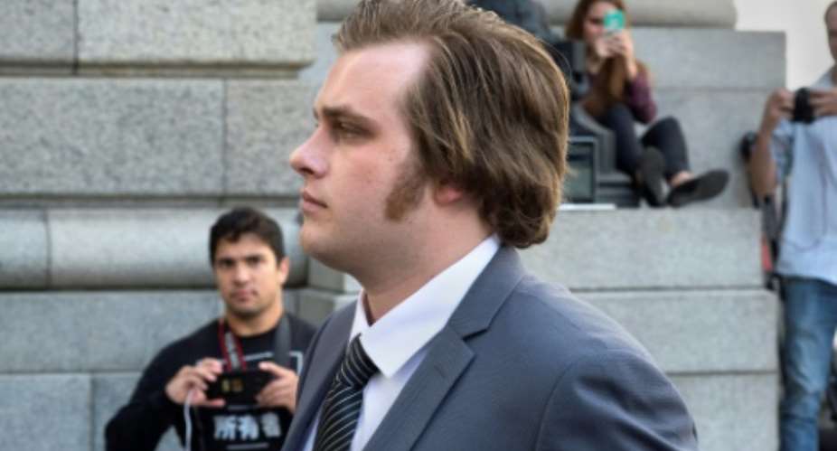 Henri van Breda, seen outside the Western Cape High Court before the start of his trial, took the witness stand to deny bludgeoning to death his two parents, and brother, and wounding his sister.  By RODGER BOSCH AFPFile