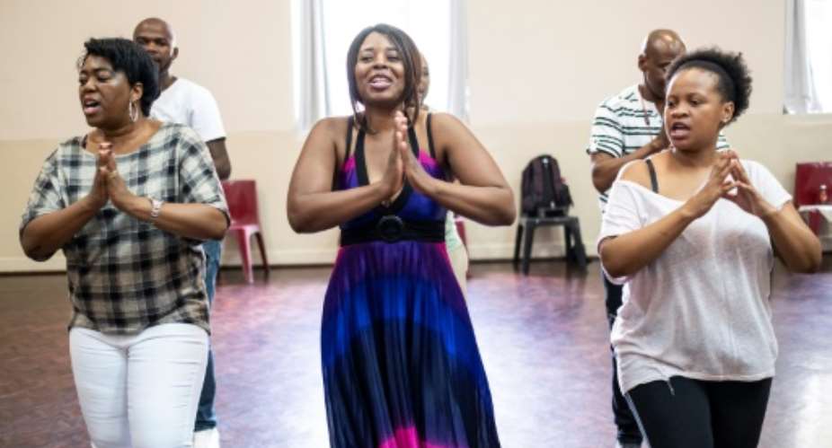 High note: The Soweto Gospel Choir, seen here in rehearsal, have won a Grammy for Freedom, a tribute to Nelson Mandela.  By WIKUS DE WET (AFP)