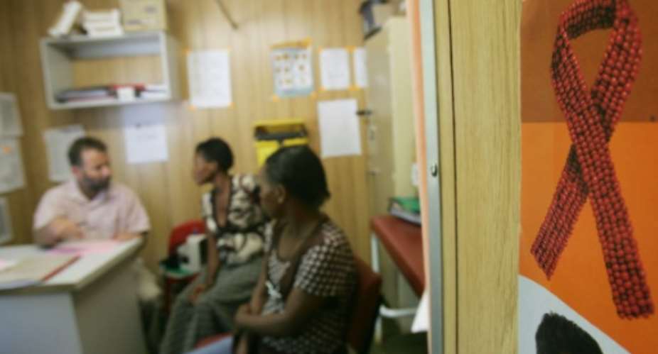 People sit in the waiting room at an anti-retroviral clinic, in Emmaus hospital in Winterton, South Africa.  By Alexander Joe AFPFile