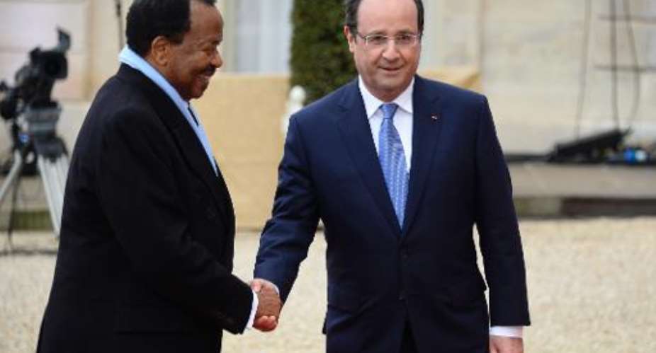 French president Francois Hollande right welcomes Cameroon's president Paul Biya to the Elysee summit on December 6, 2013 in Paris.  By Alain Jocard AFP