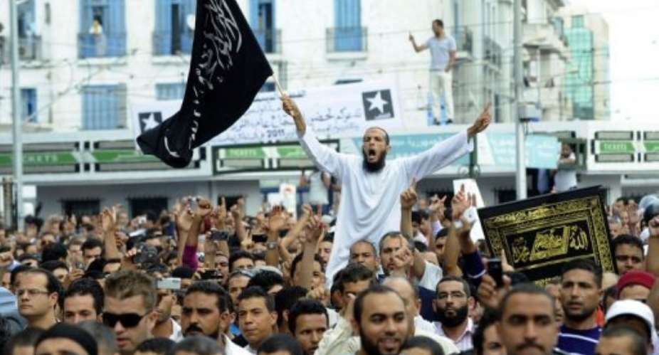 People demonstrate in front of the private Nessma TV station headquarters.  By Fethi Belaid (AFP)