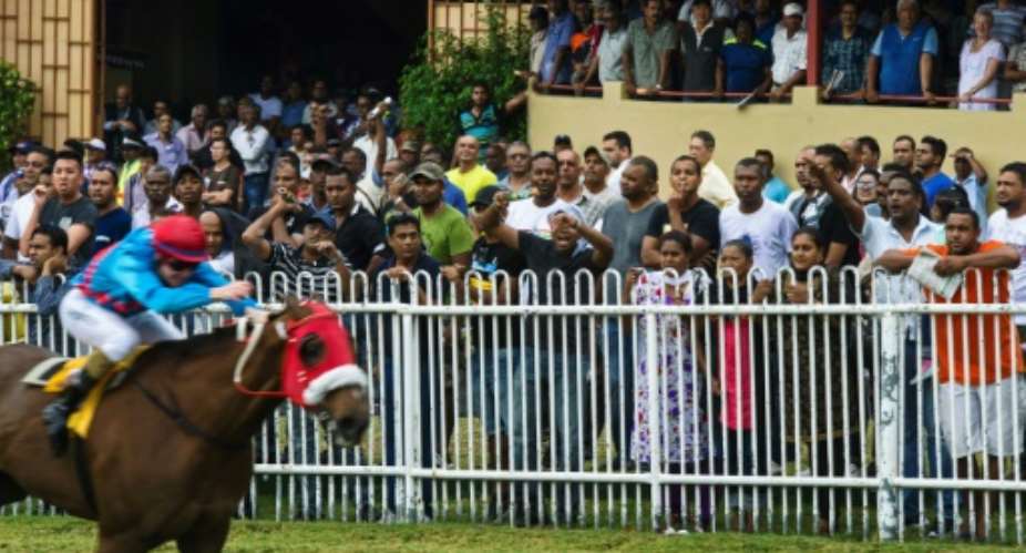 Horse racing is a virtual religion in Mauritius and the Champ de Mars racecourse its temple.  By Kirshna Pather AFPFile