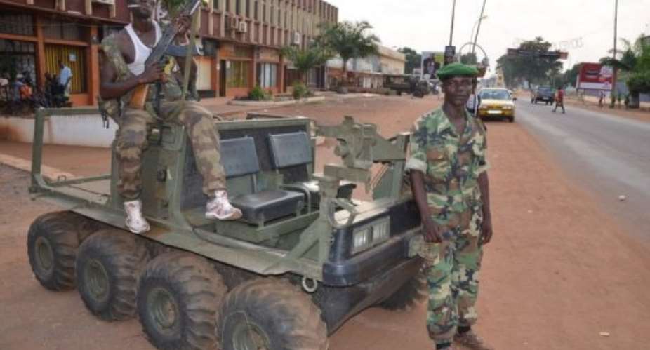 Seleka rebels, now backing Central Africas new government, pose in a South African vehicle in Bangui on April 4, 2013.  By Patrick Fort (AFP)