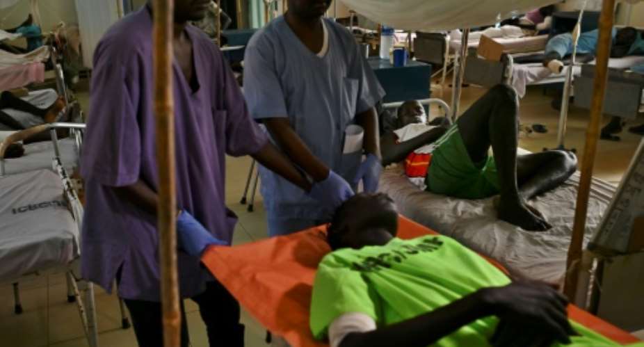Hospital wards overflow with young men disfigured by machine gun fire.  By TONY KARUMBA AFPFile