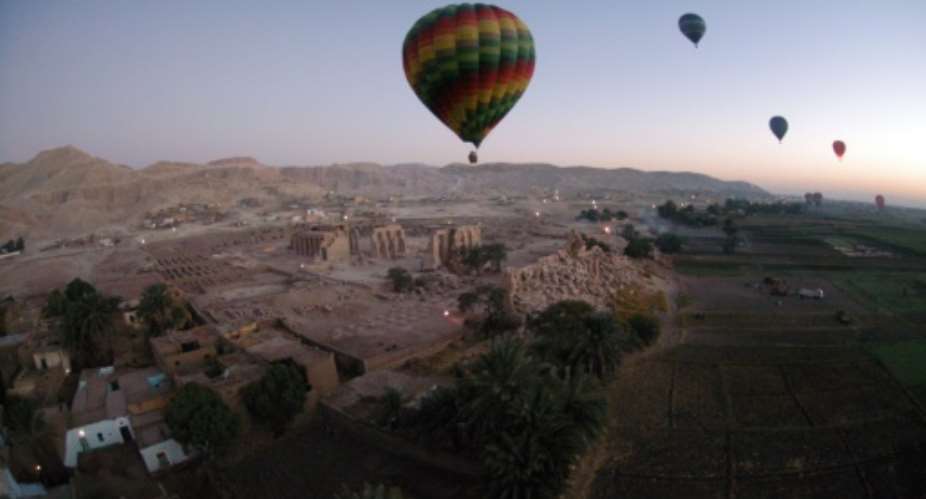 Hot air balloons fly above Egypt's Valley of the Kings, near Luxor in 2007.  By CHARLES ONIANS AFPFile