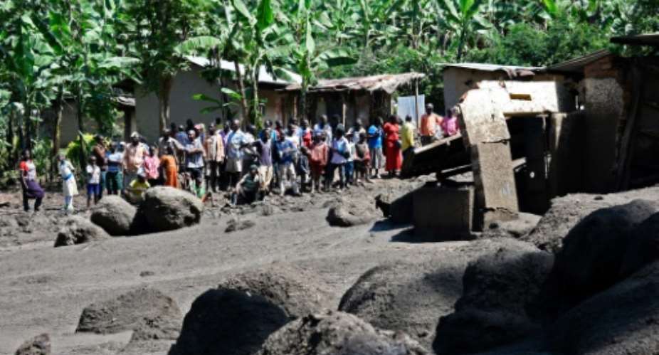 Huge boulders, some as large as cars or houses, litter Wajenwa village after Uganda's Sume river burst its banks.  By Isaac Kasamani AFP