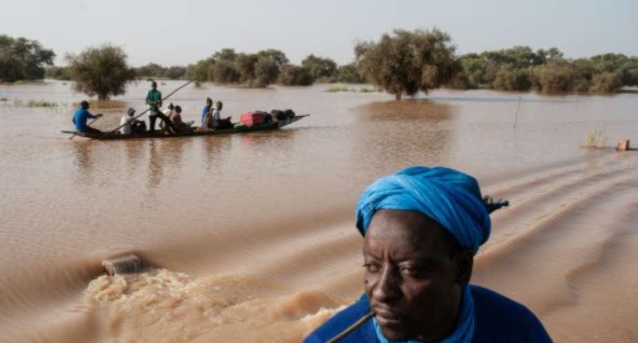 Huge swathes of farmland were submerged when the Senegal River burst its banks in October.  By GUY PETERSON (AFP)