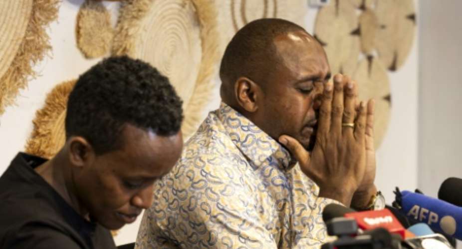 Human rights activists Boniface Mwangi (right) and Agather Atuhaire (left) speak of their ordeal during a press conference following their controversial three-day detention and alleged torture in Tanzania.  By Tony KARUMBA (AFP)