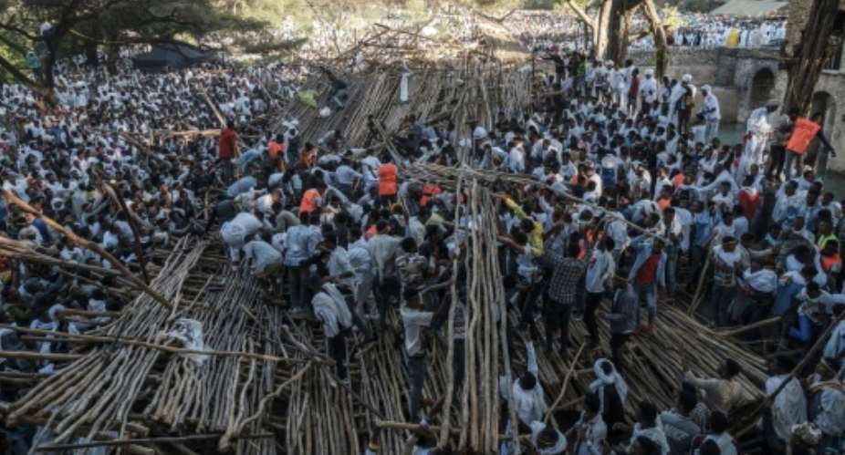 Hundreds had been sitting on a tiered wooden structure for hours when it collapsed.  By EDUARDO SOTERAS AFP