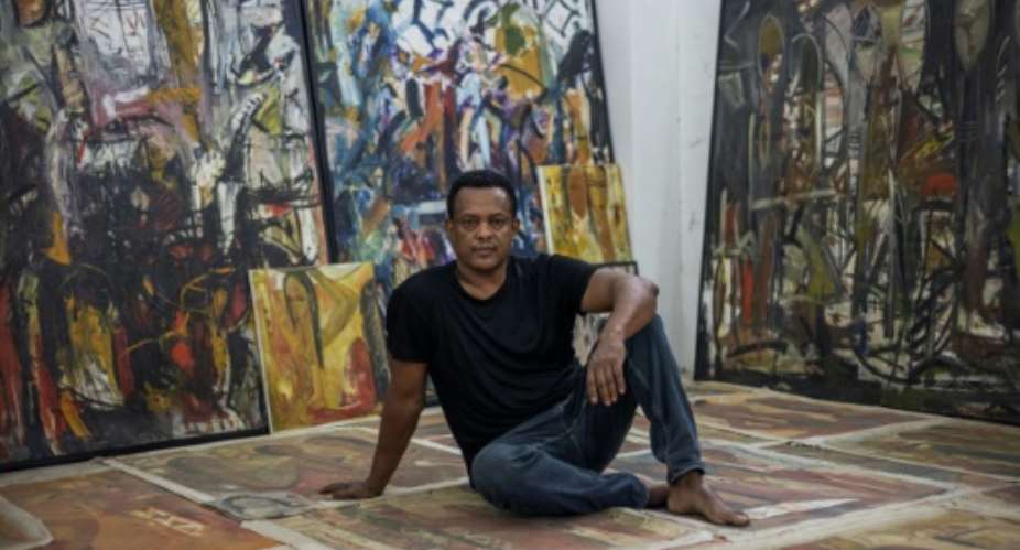 Hundreds of artworks bear witness to Fikru Gebremariams artistic evolution from figurative to abstract expressionist painter.  By Michele Spatari (AFP)