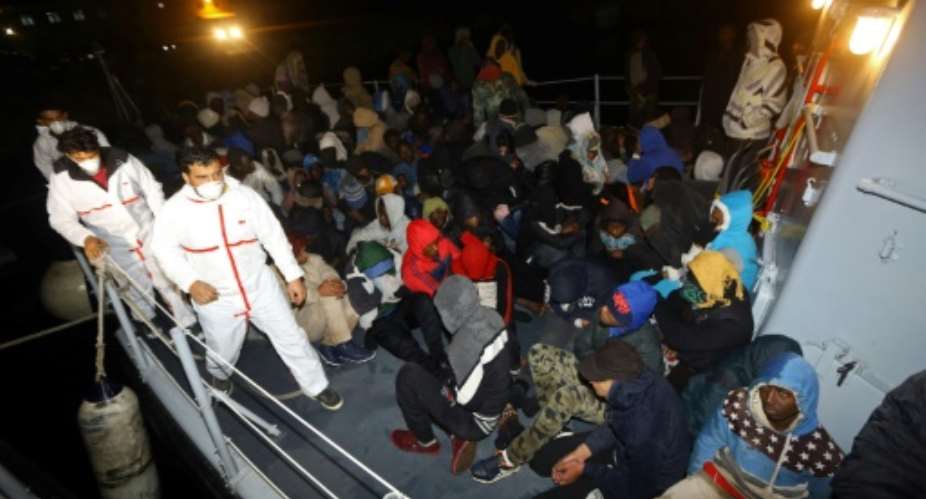 Hundreds of migrants faced being trapped at sea for days because of stormy conditions.  By MAHMUD TURKIA AFP
