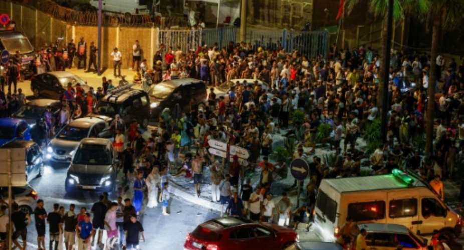 Hundreds of migrants gather in the Moroccan town next to the Spanish enclave of enclave of Ceuta.  By Abdelmajid BZIOUAT (AFP)