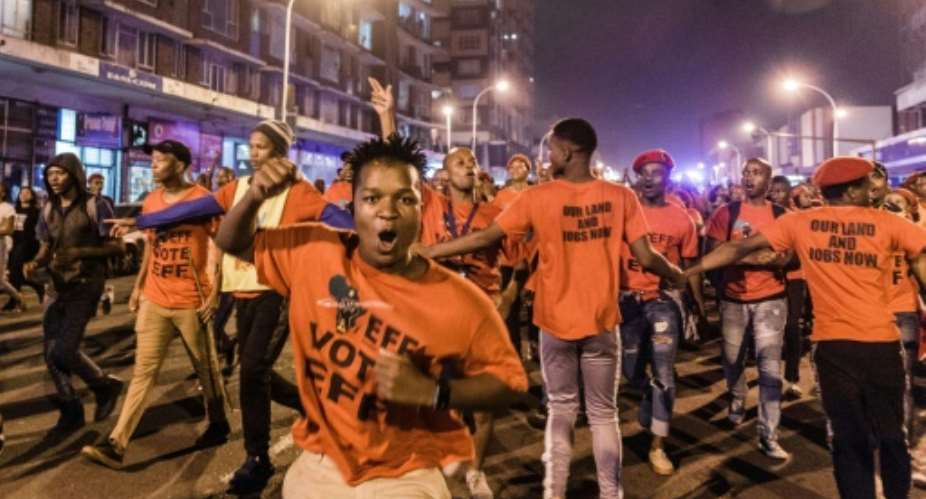 Hundreds of supporters of the opposition radical-left EFF party march in Durban on the eve of the election.  By Rajesh JANTILAL AFP