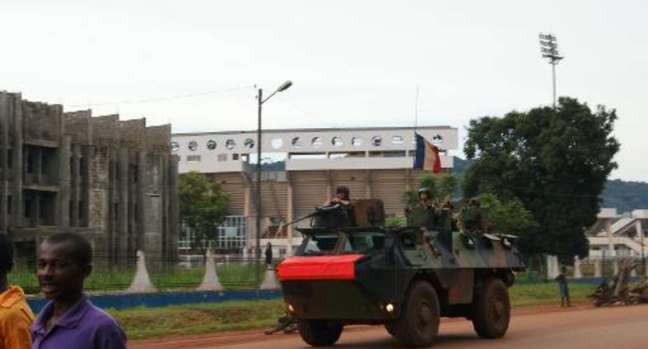 French soldiers patrol a street in Bangui, The Central African Republic on October 23, 2013.  By Pacome Pabandji AFPFile
