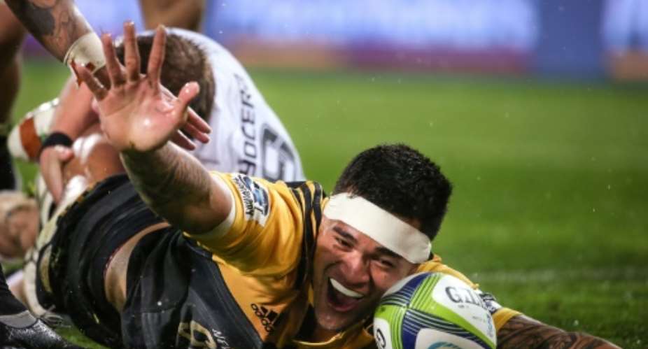 Vaea Fifita of the Wellington Hurricanes celebrates scoring a try during their Super Rugby quarter-final match against the Coastal Sharks, at Westpac Stadium in Wellington, on July 23, 2016.  By Martin Hunter AFP