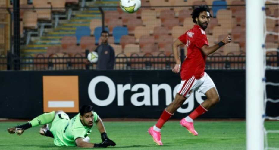 Hussein el Shahat (R) scores for Al Ahly against Esperance in a CAF Champions League semi-final second leg in Cairo.  By Khaled DESOUKI (AFP)