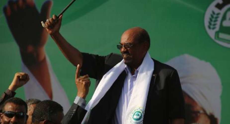 Sudanese President Omar al-Bashir C gestures to supporters after delivering a speech during an election campaign rally in Wad Madani, the capital of Sudan's east-central al-Jazirah state, on February 26, 2015.  By Ashraf Shazly AFPFile
