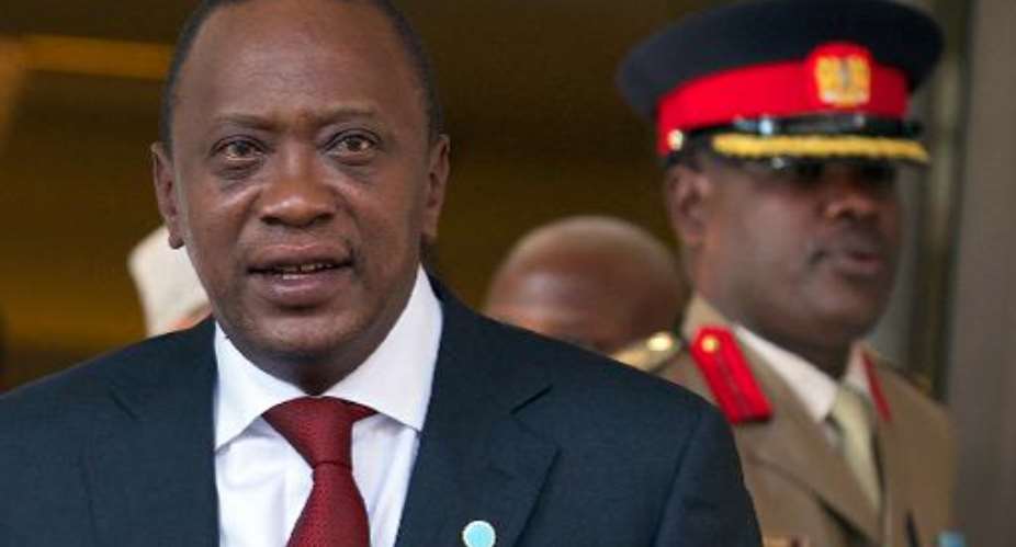 The International Criminal Courts chief prosecutor drops the case against Kenyan President Uhuru Kenyatta (L), seen here (L) in May 2013.  By Andrew Cowie (AFP/File)