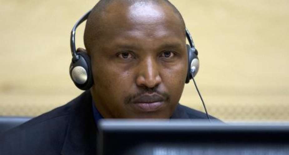 Rwandan-born Congolese warlord Bosco Ntaganda looks on during his first appearance before judges of the International Criminal Court in The Hague, Netherlands, on March 26, 2013.  By Peter Dejong PoolAFPFile