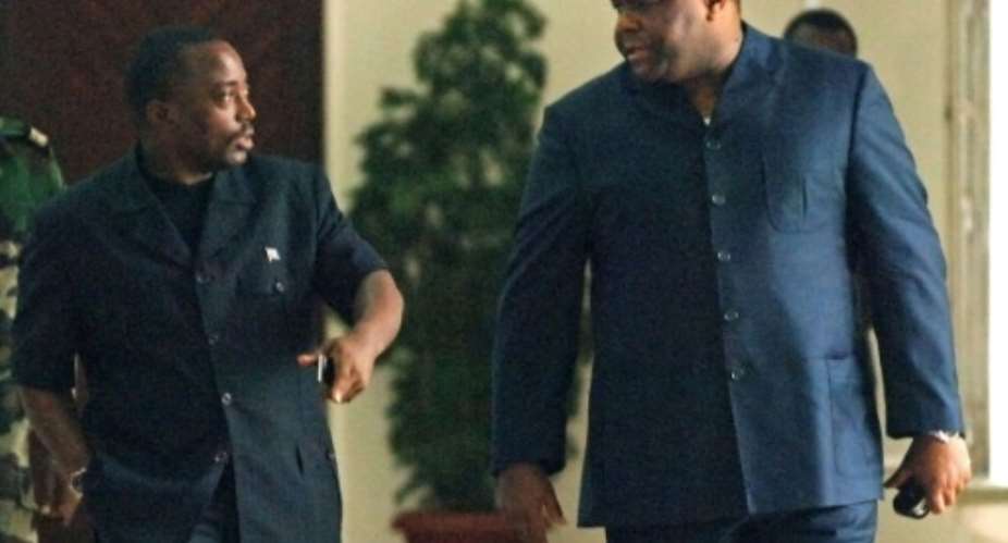 DR Congo presidential candidates Joseph Kabila L and Jean-Pierre Bemba pictured after holding talks at the presidential office in Kinshasa on November 7, 2006.  By Lionel Healing AFPFile